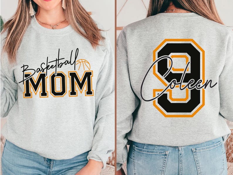 May include: Light gray sweatshirt with "Basketball MOM" in black and gold lettering. The back features a large black and gold number 9 with the name "Coleen" in script. A basketball graphic is above the word "MOM".