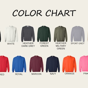 May include: A color chart displaying various sweatshirt colors. The chart includes black, white, heather dark grey, forest green, heather military green, sport grey, sand, red, royal, maroon, navy, orange, and pink sweatshirts.