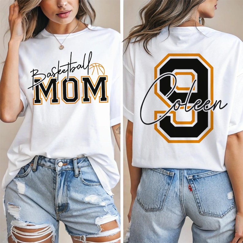 May include: White t-shirt with "Basketball MOM" in black and gold lettering on the front. The back of the shirt features a large number 9 with the name "Coleen" in a script font, outlined in black and gold. The shirt is a casual style.