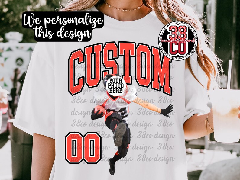 May include: White t-shirt with a custom design featuring the word "CUSTOM" in red block letters. The design includes a photo placeholder and the number "00" in red. The shirt also has the text "We personalize this design".