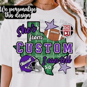 May include: A white t-shirt featuring a green Texas state outline graphic with football field markings. The design includes a purple football helmet, a brown football, two checkered stars, and the text "She's from CUSTOM I can tell 50".