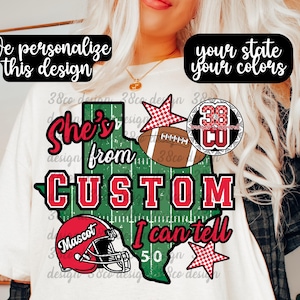 May include: A white t-shirt featuring a green football field shaped like the state of Texas. The design includes a brown football, a red football helmet with the word Mascot, two red and white checkered stars, and the text She's from CUSTOM I can tell.