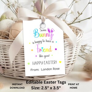 May include: White Easter gift tag with the text "Some Bunny is happy to have a Friend like you! Happy Easter!" and a bunny graphic. The tag is 6.35cm x 8.89cm and is attached to a white wicker basket with a cream ribbon.