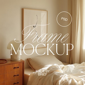 May include: A framed print of a black and white line drawing of a branch with leaves hanging on a wall in a bedroom. The bedroom has a bed with white linens, a wooden nightstand with drawers, and a white lamp. The text "Frame Mockup" is superimposed on the image.