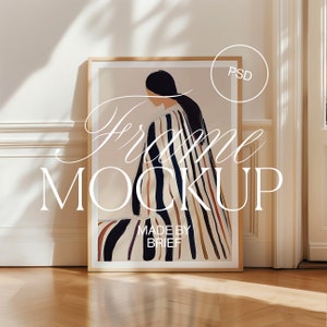 May include: A framed illustration of a person wearing a colorful striped garment. The frame is made of wood and has a white mat. The image is titled "Frame Mockup" and has the text "Made by Brief" at the bottom.