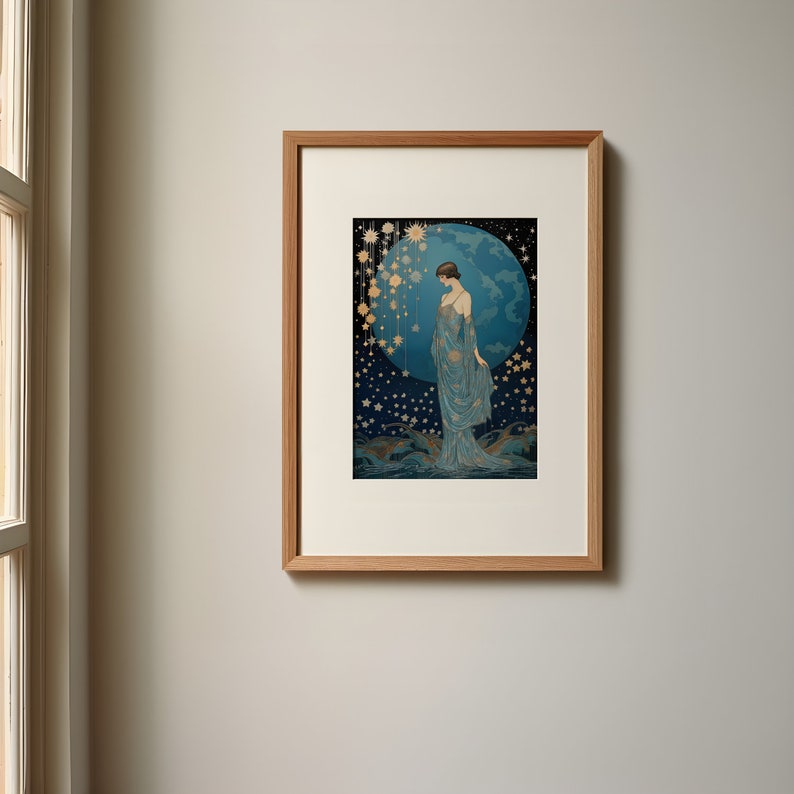 May include: A framed print of a woman in a blue gown standing in front of a large blue orb with stars and other celestial bodies surrounding her.