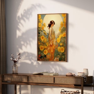 May include: A vintage art print featuring a woman in a yellow dress standing in a field of sunflowers. The woman is looking down and the sunflowers are in full bloom.