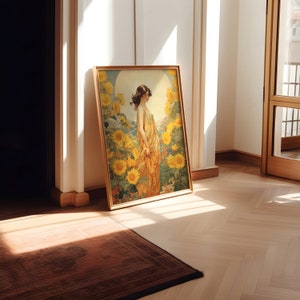 May include: A framed painting of a woman in a yellow dress standing in a field of sunflowers. The painting is in a gold frame and is hanging on a white wall.