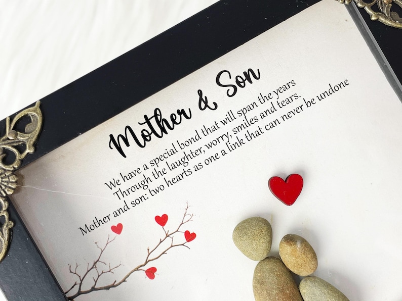 May include: A framed print with a black frame and a white background. The print features a quote about the special bond between a mother and son. The quote reads: "We have a special bond that will span the years Through the laughter, worry, smiles and tears. Mother and son: two hearts as one a link that can never be undone."