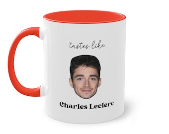 May include: White ceramic mug with a red interior and handle. The mug features a photo of Charles Leclerc with the text "tastes like" above and "Charles Leclerc" below the photo. A fun gift for Formula 1 fans.