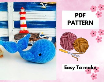 May include: A blue crocheted whale with a detailed tail fin. The image also features a miniature lighthouse, a nautical-themed backdrop, and the text "PDF PATTERN" and "Easy To make."