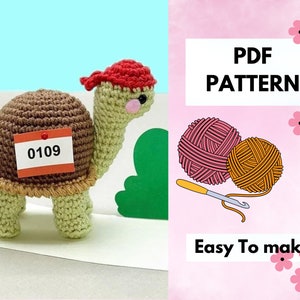 May include: Crochet amigurumi turtle pattern PDF. The pattern includes instructions for making a brown and green turtle with a red hat. The pattern is easy to follow and includes a photo of the finished product.