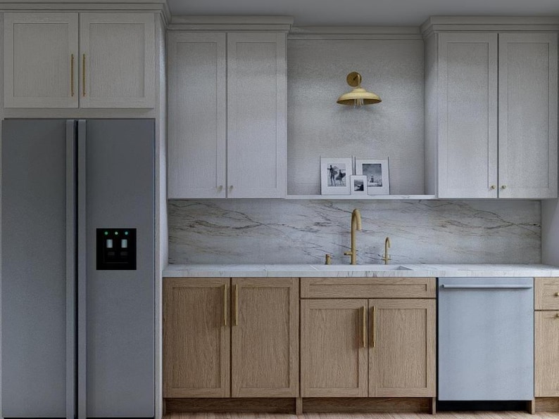 May include: A modern kitchen with light-colored cabinetry and a stainless steel refrigerator. The kitchen features a marble countertop, a gold faucet, and a stainless steel dishwasher. Decorative framed pictures are on a shelf above the sink.