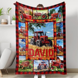 May include: Red and black fleece blanket with a checkered pattern. The blanket features multiple images of red tractors with the name "DAVID" in the center.