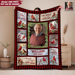 May include: A personalized memorial blanket featuring a photo of a person, surrounded by images of red cardinals and text. The blanket has a red and black plaid border and includes the text "Those we love don't go away" and "They walk beside us every day."