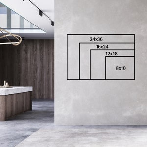 May include: A white wall with four black frames showing different sizes of prints. The frames are labeled with the dimensions in inches: 24x36, 16x24, 12x18, and 8x10.