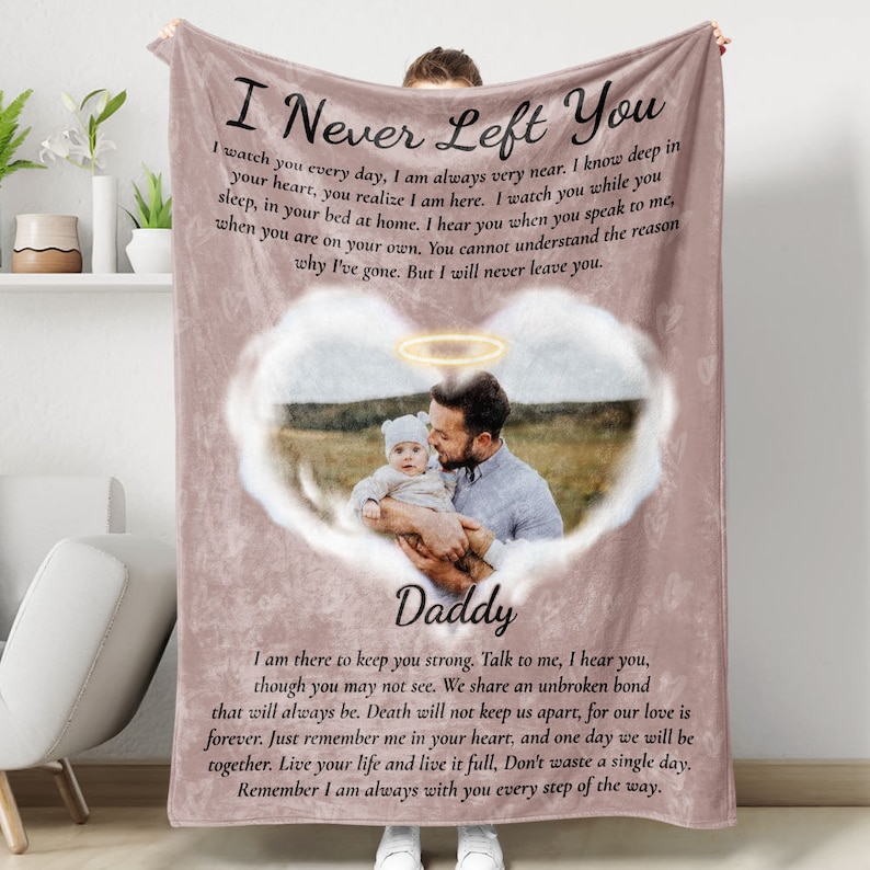May include: A pink fleece blanket with a heart-shaped cloud and a photo of a father and child. The text "I Never Left You" and "Daddy" are printed on the blanket.