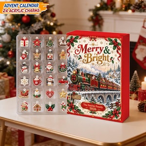 May include: An advent calendar box featuring a red and white design with a steam train illustration, the text Merry & Bright, and The Smiths Family 2026. Beside it is a clear plastic tray containing 24 colorful acrylic charms of holiday icons.