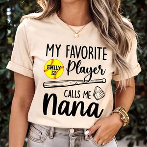 Personalized Softball My Favorite Player Calls Me Nana T-shirt, Custom Grandma Baseball Shirt, Softball Grandma Mimi Nana Shirt