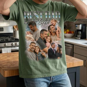 May include: Olive green t-shirt with a collage of family photos and the text "BEST DAD Ever" in a silver, metallic font. The photos show a father with his children at different ages, creating a sentimental design.
