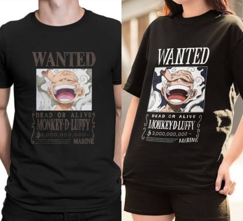 May include: Black t-shirt with a graphic print of a wanted poster featuring a cartoon character with the text "WANTED DEAD OR ALIVE? MONKEY D LUFFY $3,000,000,000 - MARINE".