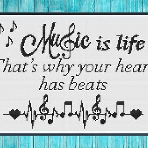 May include: Black and white cross-stitch design with the text "Music is life That's why your heart has beats" and a musical note heartbeat graphic.