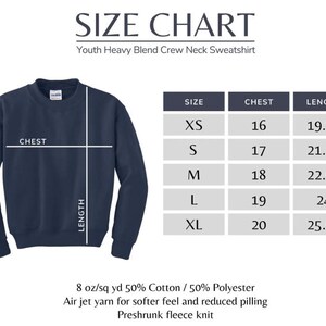 May include: Navy blue crew neck sweatshirt with a size chart. The chart lists sizes XS to XL, chest measurements from 16 to 20 inches, and lengths from 19.75 to 25.50 inches. The sweatshirt is made of 50% cotton and 50% polyester.