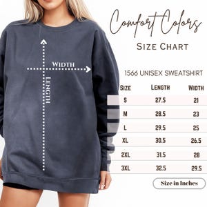 May include: A dark blue unisex sweatshirt with a size chart. The chart shows the length and width measurements in inches for sizes S to 3XL. The text "Comfort Colors" and "1566 Unisex Sweatshirt" are also visible.