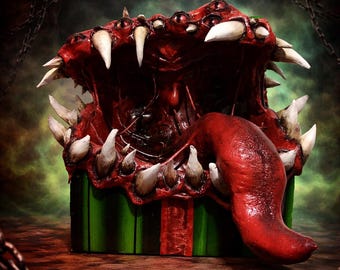 Christmas gift with a giant eye monster