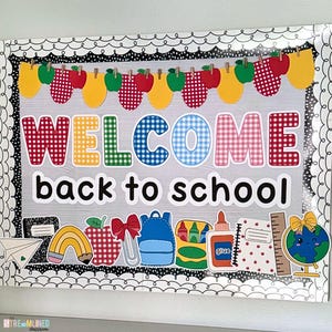 May include: A classroom bulletin board display featuring the text WELCOME back to school. The design includes a banner of apples and yellow shapes, with illustrations of a pencil, paper, backpack, crayons, glue, ruler, and a globe.