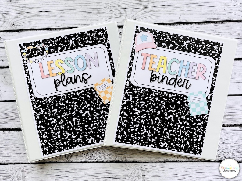May include: Two white binders with black and white speckled covers. One binder reads "LESSON plans" in pastel colors, the other reads "TEACHER binder". Each binder has a small decorative sticker. The binders are on a light wood surface.
