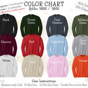 May include: Color chart for Gildan 18000/18500 sweatshirts, showing 12 different colors: black, forest green, dark heather, military green, maroon, red, light blue, sport grey, white, sand, light pink, and orange. The sweatshirts are 50% cotton and 50% polyester.