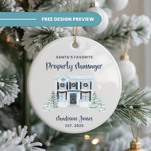 May include: A white ceramic Christmas ornament with a watercolor illustration of a house, snow-covered trees, and the text "SANTA'S FAVORITE PROPERTY MANAGER". Includes a name and the year 2025.