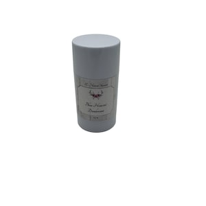 May include: A white cylindrical deodorant stick container with a label featuring the text SE Natural Skincare, a graphic of antlers with flowers, and the words Blue Hawaii Deodorant, with a net weight of 0.5 oz printed at the bottom.