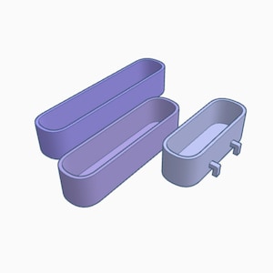 May include: Three purple plastic rectangular planters with rounded edges. The smallest planter has two small feet on the bottom.