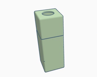 May include: A light green square-shaped container with a round opening on the top.