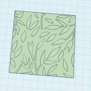 May include: A square green fabric with a pattern of black leaves and branches.