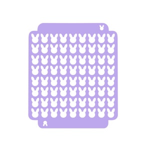 Könnte beinhalten: Eine violette Schablone mit einem sich wiederholenden Muster aus weißen Hasensilhouetten.