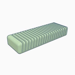 Puede incluir: Un organizador de plástico verde claro con múltiples ranuras para guardar objetos. El organizador está diseñado para mantener los objetos en posición vertical y de forma ordenada.