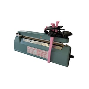 May include: A grey impulse sealer with a black power cord and pink cord holders. The sealer has a silver sealing bar and a label that reads "Impulse Sealer Model: FS-200 110V AC 50/60Hz Power: 300W".