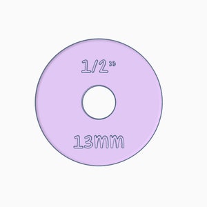 Puede incluir: Una arandela de color lila claro con un diámetro interior de 1/2 pulgada y un diámetro exterior de 13 mm.