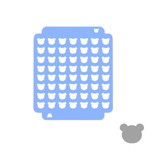 May include: A pale blue stencil featuring a grid of white bear-shaped cutouts. A small, grey bear shape is in the lower right corner. The stencil is set against a white background.