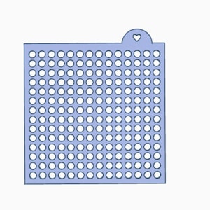 May include: A light blue, square-shaped stencil with a grid of evenly spaced circular holes. A small tab at the top features a heart-shaped cutout. The stencil is designed for crafting and decorative purposes.