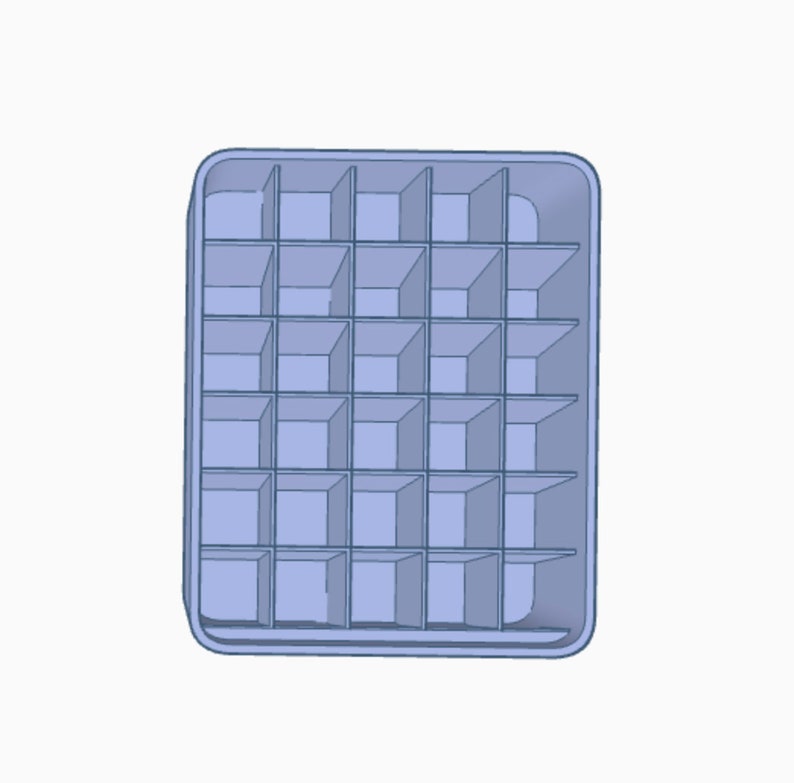 May include: A blue plastic ice cube tray with 24 individual compartments.