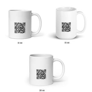 May include: Three white ceramic mugs with a black QR code design. The mugs are available in three sizes: 11 oz, 15 oz, and 20 oz.