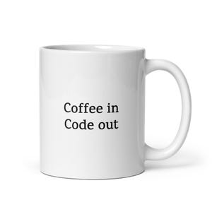May include: White ceramic coffee mug with the text "Coffee in Code out" in black. The mug has a curved handle and is suitable for hot or cold beverages. A simple, yet functional design.
