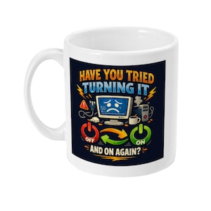 May include: White ceramic mug with a humorous design. The mug features the text "HAVE YOU TRIED TURNING IT OFF AND ON AGAIN?" along with a cartoon image of a sad computer screen, power buttons, and other computer-related graphics.