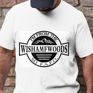 May include: White t-shirt with a black and white graphic of a mountain range and the text "I'm from the Wishamfwoods So F.A.F.O."