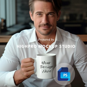 May include: A white ceramic mug with a black handle. The mug has the text "Your Design Here" printed on it. The mug is being held by a person wearing a white shirt. The image is labeled "Prepared by HIGHPRO MOCKUP STUDIO".