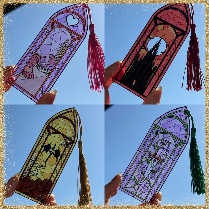 May include: Four rectangular bookmarks with stained glass designs. Top left: purple with a heart and basket. Top right: orange with a dark castle silhouette. Bottom left: yellow with a black dragon. Bottom right: purple with a floral sword design.